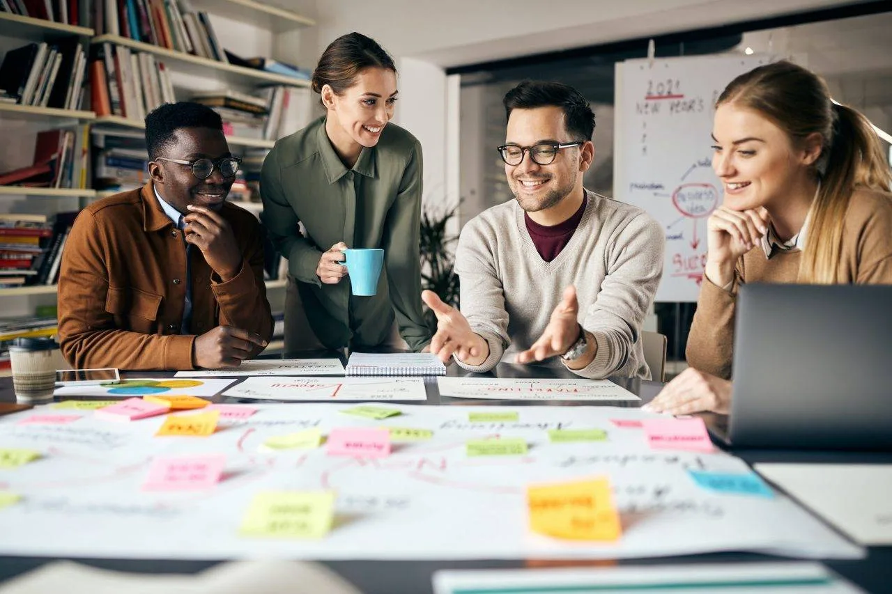 Happy Creative Marketing Team Working On New Business Project In The Office | AR Webcrafts